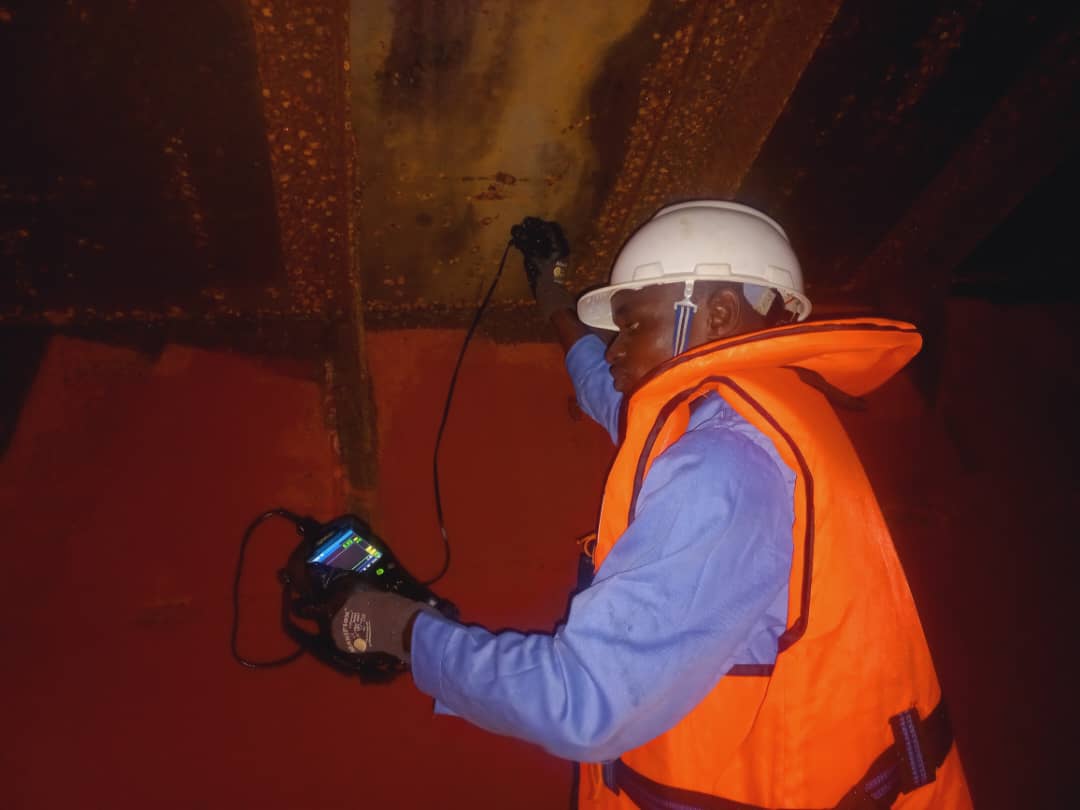 Zeclipse Integrity technician performing field NDT inside a barge cargo hold